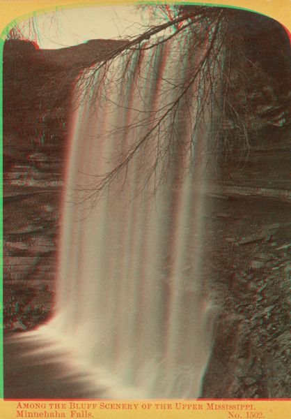 Stereograph of Minnehaha Falls during summer. Text at bottom: "Among the Bluff Scenery of the Upper Mississippi. Minnehaha Falls. No. 1502."