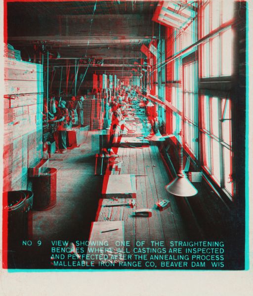 View of the work area along windows where casting inspection takes place. Caption on stereograph reads: "No. 9 View showing one of the straightening benches where all castings are inspected and perfected after the annealing process. Malleable Iron Range Co, Beaver Dam, Wis."