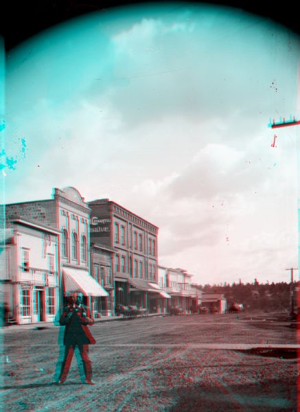 Stereograph of a man on Main Street in Black River Falls, ca. 1886, created by Van Schaick or his colleague, Thomas T. McAdam.