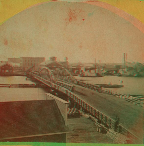 Stereograph of Main Street bridge, looking toward a section of the city known locally as Brooklyn.