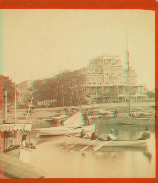 Stereograph view of the Whiting House with its large harbor and boats.