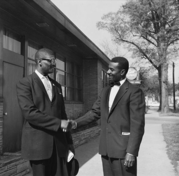 Rev. Fred Shuttlesworth, (in bow tie) and Rev. J.S. Phifer, congratulate each other after their release from jail. The two men had been imprisoned together for their efforts to integrate Birmingham schools.