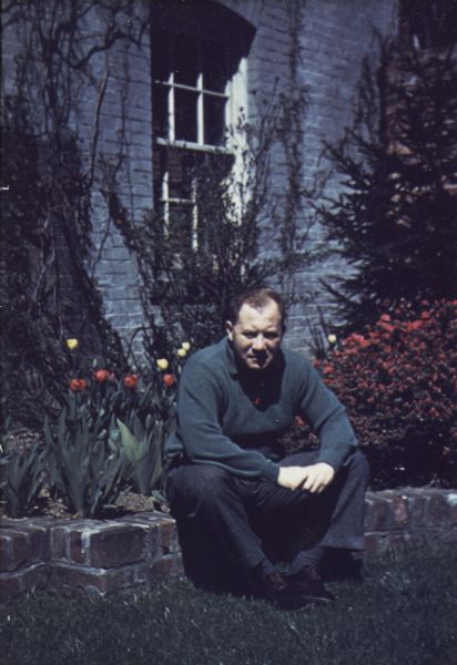 Journalist Robert S. Allen seated in the garden behind his Washington, D.C. home as photographed in the rare Triak color photography process.
