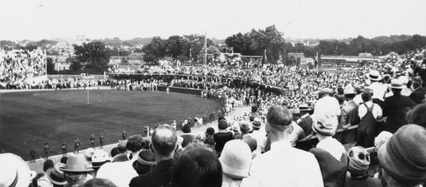 View from stands of crowd gathered for the arrival of Charles Lindbergh and his famed airplane the "Spirit of St. Louis".
