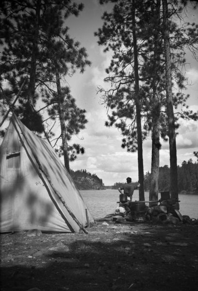 Sig Olson at a wilderness camping site, probably in the Quetico area.