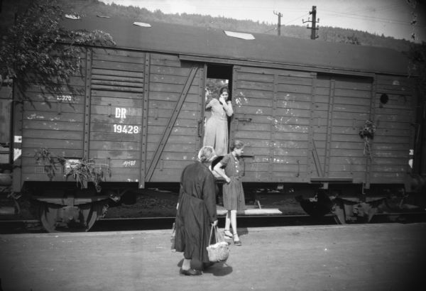 Refugees traveling by boxcar.  Although the location is unidentified it was probably taken by Sigurd Olson in or near Berlin either late in 1945 or early in 1946.