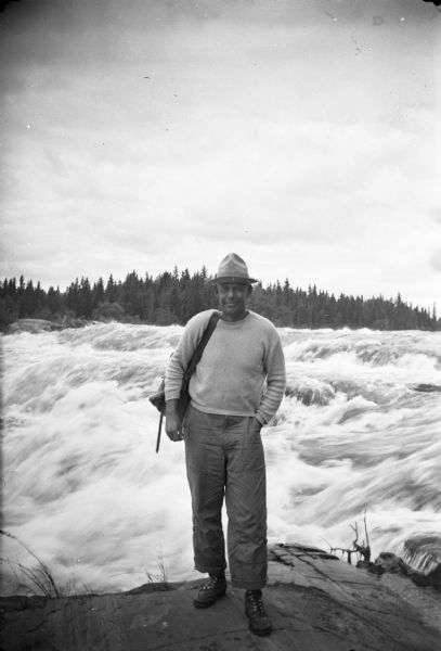 Sigurd Olson, wearing his characteristic attire, on a trip on the Upper Churchill River.