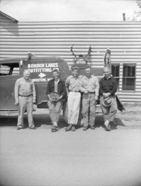 Sigurd Olson (second from the left), his two sons on the right, and two unidentified men, thought to be wilderness guides who worked for his Border Lakes Outfitting Company.
