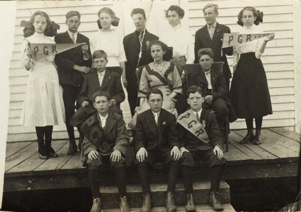 Conservationist Sigurd Olson (front row, left) posing with his class, probably at Prentice, Wisconsin.