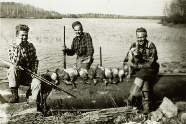 Sigurd Olson with his sons, Robert and Sig Jr., after a duck hunt.