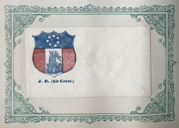 The "crest" of Jefferson Davis has a horizontal blue field at the top with white stars representing the seceding states. Three vertical fields (red-white-red) are on the bottom. A devil sitting on a bale of cotton is in the middle field. Blue and red ink on a cream envelope, illustration on upper left. Image printed on envelope, mounted on a decorative border and collected in an album.
