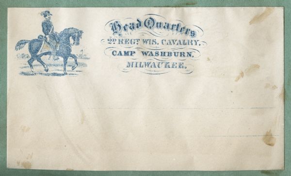 A cavalry soldier on a horse appears on left, a military camp is seen in the background.
To the right in fancy type:
"Head Quarters,
2D REGT. WIS. CAVALRY.
CAMP WASHBURN,
MILWAUKEE."
Blue ink on beige envelope, image on left side.
Image printed on envelope, mounted on various colored pages and collected in an album.