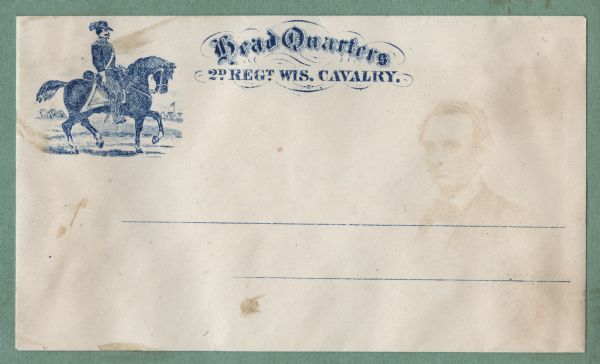 A cavalry soldier sits on his horse, with a military camp and flag in the background. The faint image of Abraham Lincoln is from the opposite envelope in the album.
To the right in fancy type is the text,
"Head Quarters
2D REGT. WIS. CAVALRY."
Blue ink on beige envelope, image in upper left corner.
Image printed on envelope, mounted on various colored pages and collected in an album.