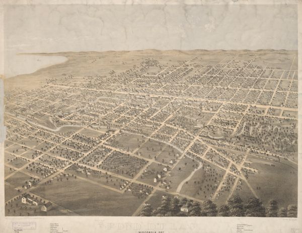 Birds eye drawing of Fond du Lac depicts street names and street layouts, houses, buildings, trees, and the Fond du Lac River. A reference key at the bottom of the map shows the locations of the city's court house, high school, and specific denominational churches (Episcopal, Baptist, Methodist, Presbyterian, Congregational, Lutheran, German, Irish, and French).