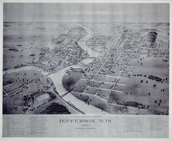 Bird's-eye map of Jefferson, looking north. Crayfish River at left and center, Rock River from upper center to bottom center, joins at left of center; thirty-eight locations identified in key below image; Pleasant Street at top left corner, Cemetery Street at top right corner, Ft. Atkinson Street at bottom left, Dane Street at bottom right corner.  One bridge across Crayfish river at confluence; four bridges cross Rock River.