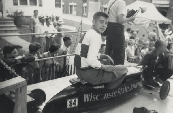 1950 Madison, Wisconsin soap box derby champion Warren Slightam about to compete in an exhibition race at the 1951 Madison soap box derby on Gorham Street.