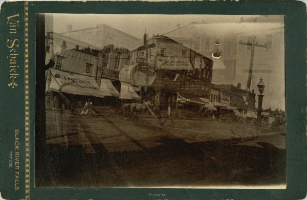 A double exposure of Main Street. Writing on the back of the print reads: "No good film was exposed twice."