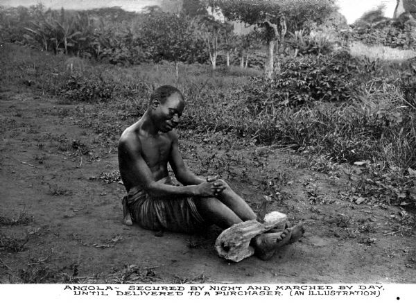 View of an Angolian prisoner with hands and feet bound in a wooden brace. Caption reads, "These methods were used to capture and hold the prisoners which were secured by night and marched by day until delivered to the purchaser."