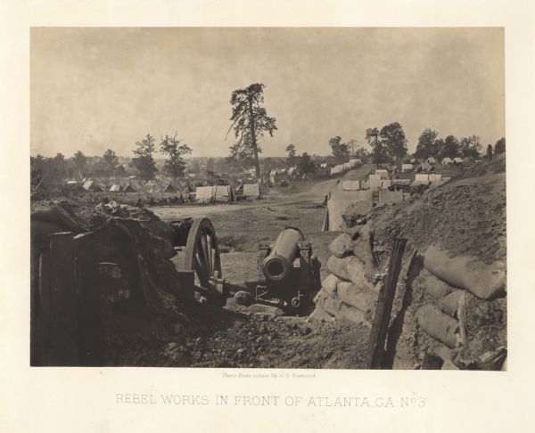 One of the Confederate defenses around the city, with a cannon and earthworks in the foreground. Tents are in the background among trees.<br>Plate 41</br>