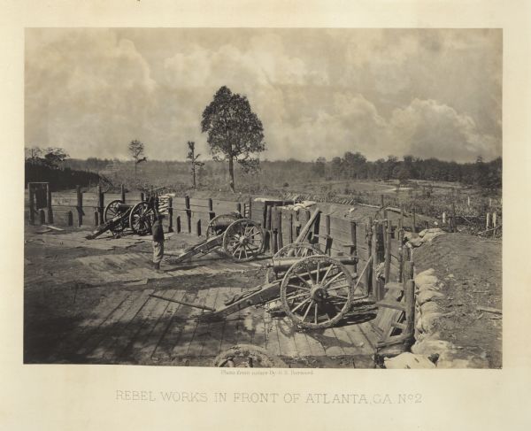 One of the Confederate defenses around the city, with several cannons behind earthworks. A Union soldier stands near one of the cannons.<br>Plate 40</br>