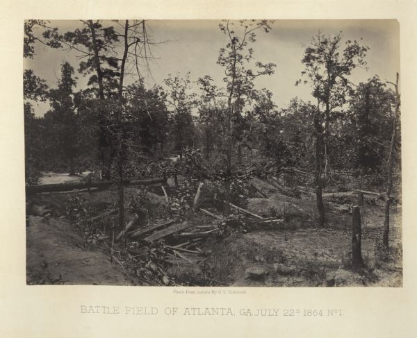 An empty battlefield with debris among trees.<br>Plate 36</br>