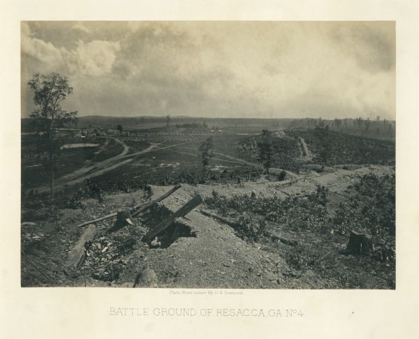 View of earthworks at the battlefield at Resacca. Dirt roads cross the field in the distance, leading to a farm and what appears to be a river.<br>Plate 22</br>