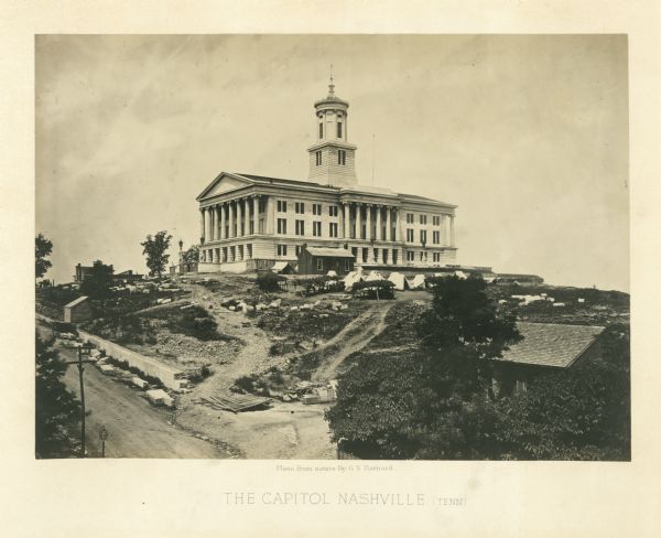 The capitol building is on a hill overlooking the city. Union soldiers have pitched tents on the grounds.<br>Plate 02</br>