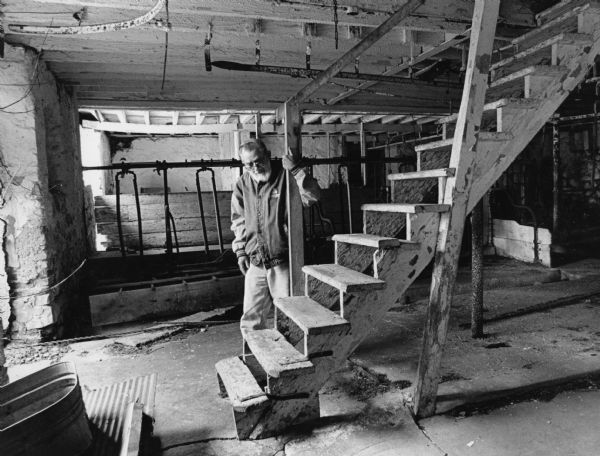 Gordan Grantman stands in the barn which was once used by the Paul Dirks family.