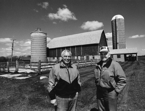 Bill and Werner Steinbach pose in front of this barn, built in 1924. The barn is at W2288 Gill Road. The last time cows were milked here was in November, 1987.