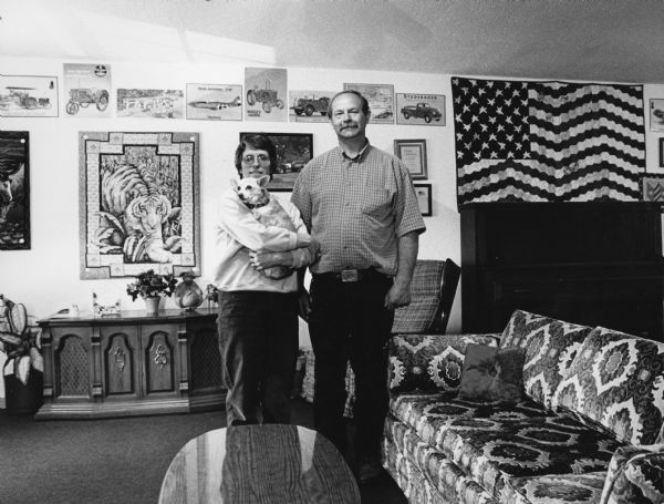 Andy and Karen Schnitzler and "Ruffy" pose in their Community Center. The Schnitzlers purchased the farm in 1980 and began the center in 1988.