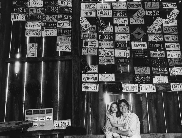 Julie Bacon's husband, Stuart, has a license plate collection on the wall in the barn.