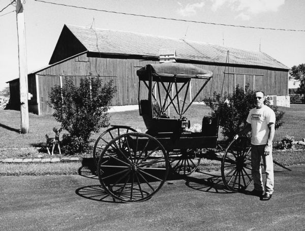 Dale Christian rides this fine, old carriage to the "River Church" when a special German service is held.
