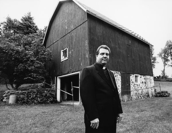 This old barn is on Immanuel Lutheran Church (River Church) property at N8076 Cty Tr AY. Pastor Mark Berlin poses for the picture.