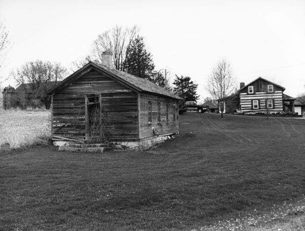 This old one-room schoolhouse is on the Priestaf property. Called the "Good Road School," it was closed in the 1950s. The Priestaf house is a log building.