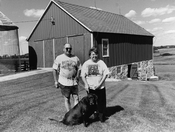 The Bonacks, with their dog Bailey, have this old structure on their property.