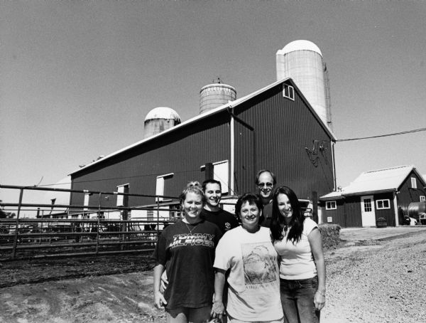 The John and Jeanie Schnitzler family live at N7861 Doyle Rd (Section 26). Pictured are: Kelly Clark, Jason, Jeanie, John, and Amanda Schnitzler. They currently milk 70 cows.