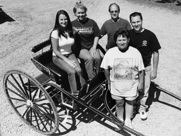 The Schnitzlers posed with this fancy Meadowbrook Cart.