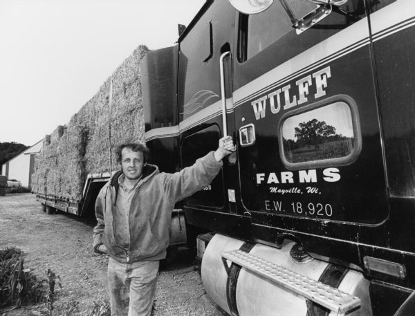 Kevin Wulff is shown with a load of hay containing 40 bales. He has lived here since 1991.