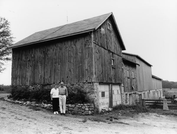 Cliff and Renoda pose by this old granary.