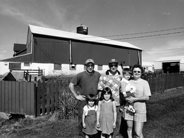 This is the Gygax farm at N9699 Hiawatha Rd (Section 4). Pictured are Leroy and Mary, their son, Kevin, and grandchildren Taylor, Tori, and Chase Wondra.