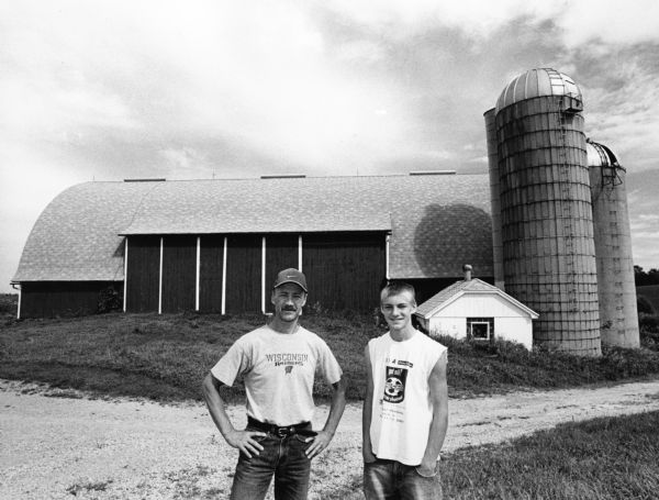 Loren Giese and his son Nathan are pictured at this barn at N7473 Hwy AY (Section 31). Loren and his wife Shirley, have lived here since 1982.