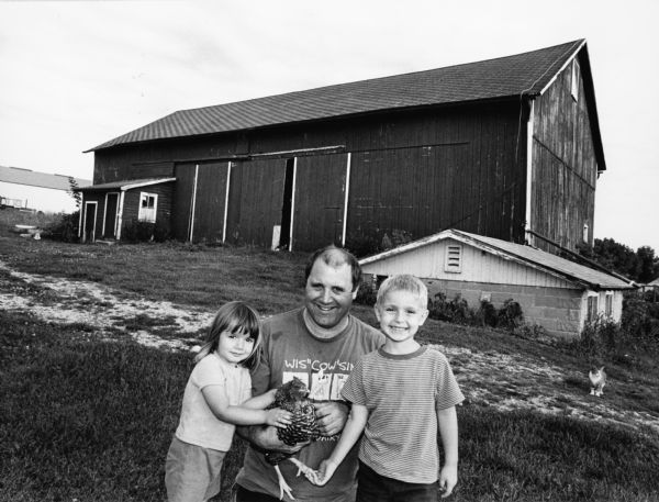 Dave Straub and children, Sophie and Venice, and their friendly chicken, live at N8089 Doyle Rd (Section 26). Dave has lived here since 1991.