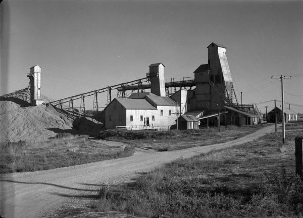 View from road of lead and zinc mines and surrounding buildings.