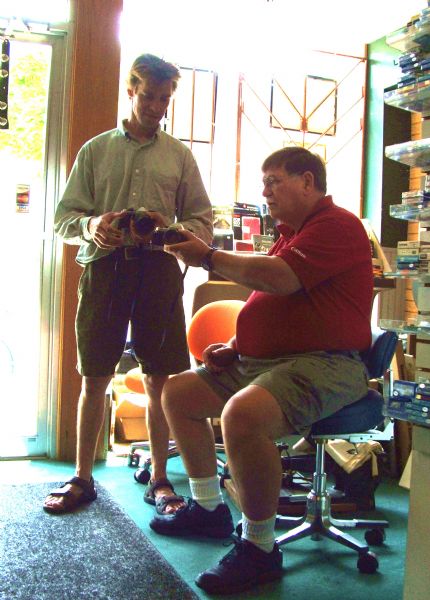 "Bob's Moen Photo" Owner Bob Mulock (on the right) with customer Hans Laping.