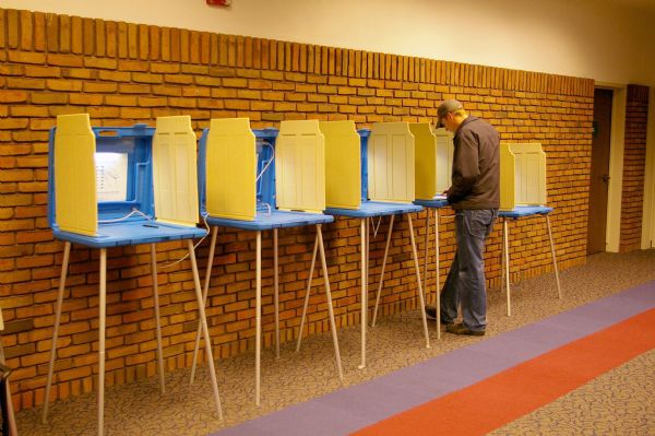 Man submitting vote for Wisconsin Primary.