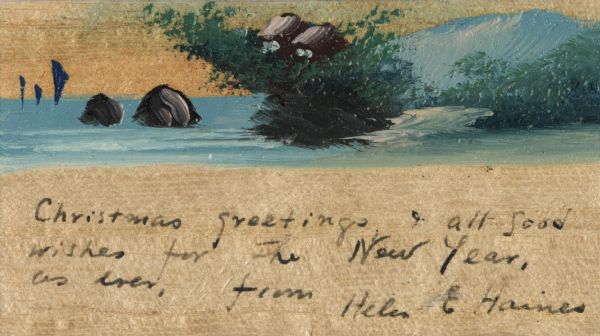 Hand oil painted holiday card on wood. The scene is a seashore with foliage and rocks, two houses in the distance, and a snow-covered mountain in the background. The handwritten message reads: "Christmas greetings & all good wishes for the New Year, as ever. From Helen & Haines."
