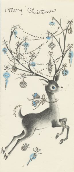 Holiday card with a leaping reindeer on it. He has a bow with bells around his neck. His extensive antlers have an assortment of ornaments and garland hanging on them. The text "Merry Christmas" appears at the top. Printed in black and blue ink. The ornaments, bells and garland are thermography in metallic silver.