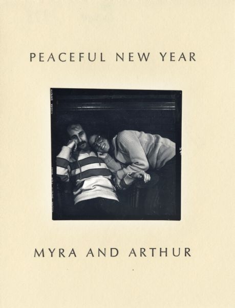 Holiday card with the word "PEACEFUL" embossed seven times on the front (not shown). On the inside, a photograph of a couple is glued in the center. Above reads: "PEACEFUL NEW YEAR" and below "MYRA AND ARTHUR." The photograph shows the edges of the negative. The card is letterpress on cream colored textured paper.