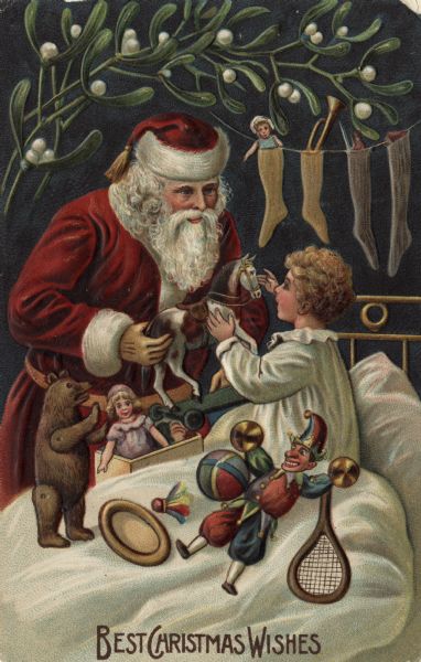 Holiday postcard with Santa Claus at the bedside of a child, handing out toys. There are dolls, a bear, a badminton racket and bird, ball and a toy horse. Santa Claus is wearing the traditional red suit and hat trimmed with white fur. There are stockings filled with toys, dolls and a horn on a line hanging over the headboard. Mistletoe decorates the top of the card. Text at foot reads: "Best Christmas Wishes." Chromolithograph and embossed. Printed in Germany.