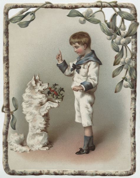 Holiday card featuring a boy and his dog. The boy is wearing a white and blue sailor suit. The dog is sitting up and begging with a sprig of holly in his mouth. The image has a frame of branches and mistletoe. Chromolithograph. Outside of card and left and right corners are die cut.